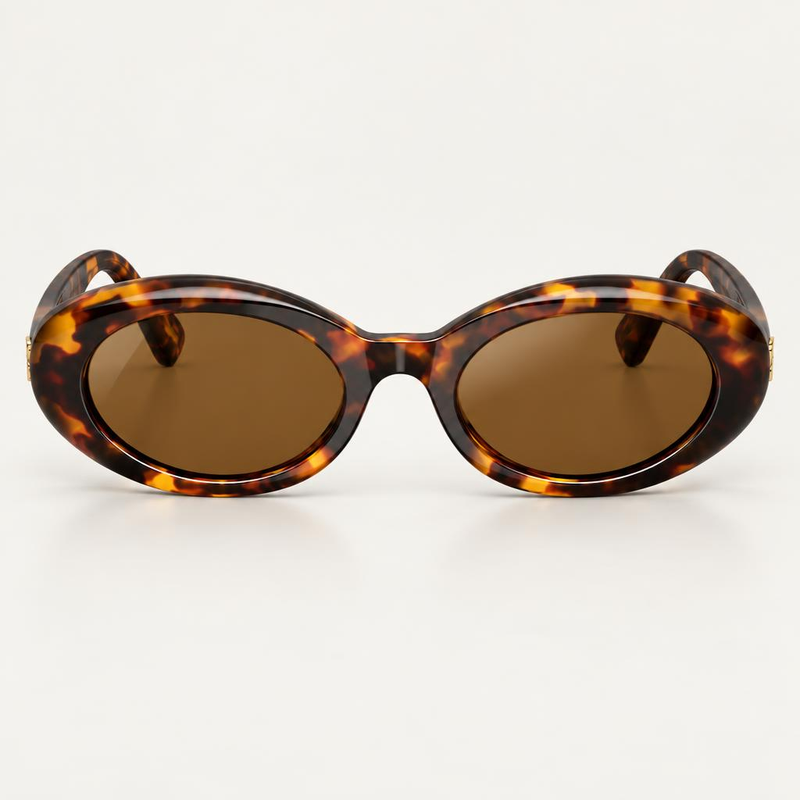 Óculos Luna da Solune, com formato oval, contorno espesso em tons de tartaruga e lentes marrons.